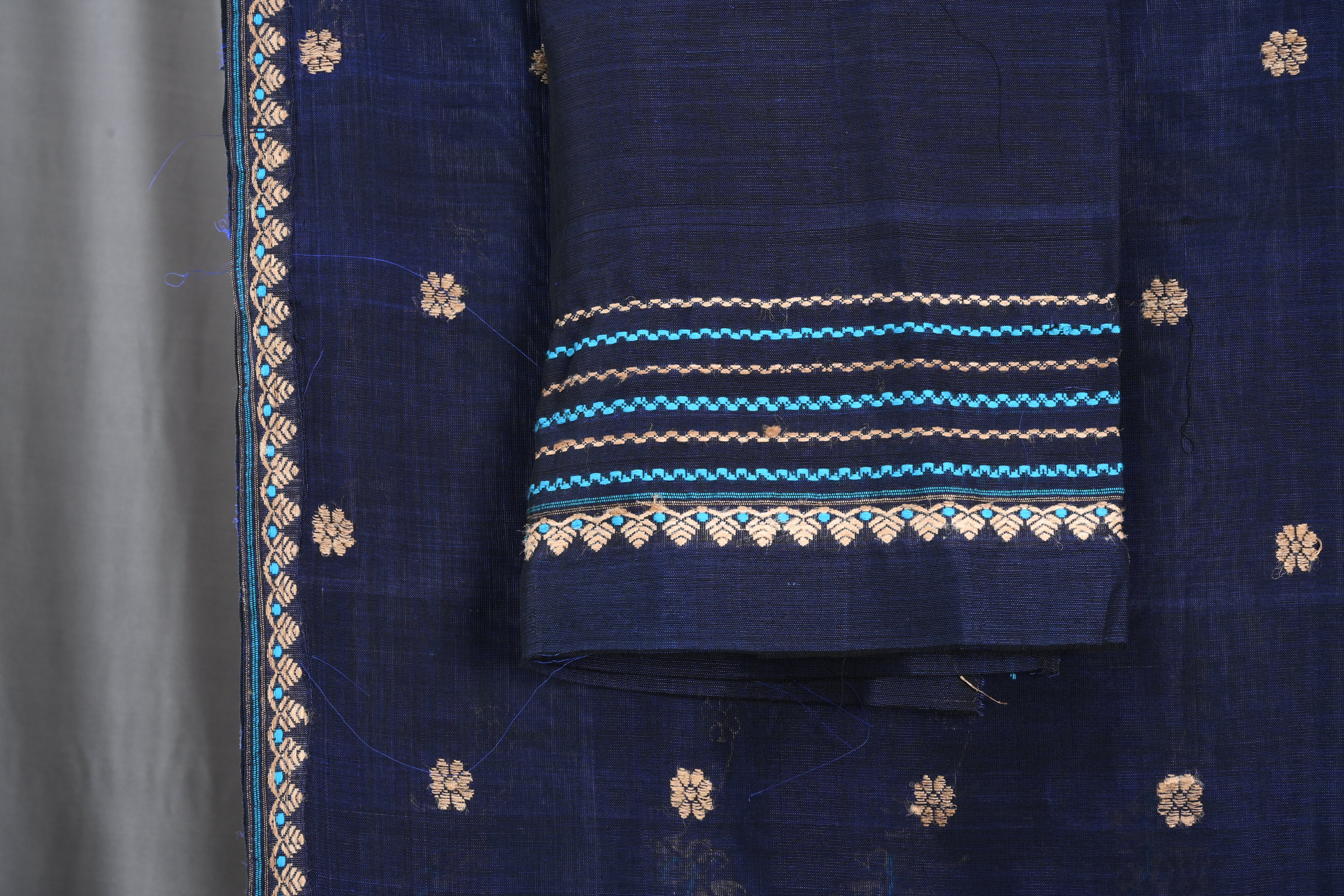 Navy Blue Raw Cotton Mekhela Sador with Muga Ghecha Thread Motifs