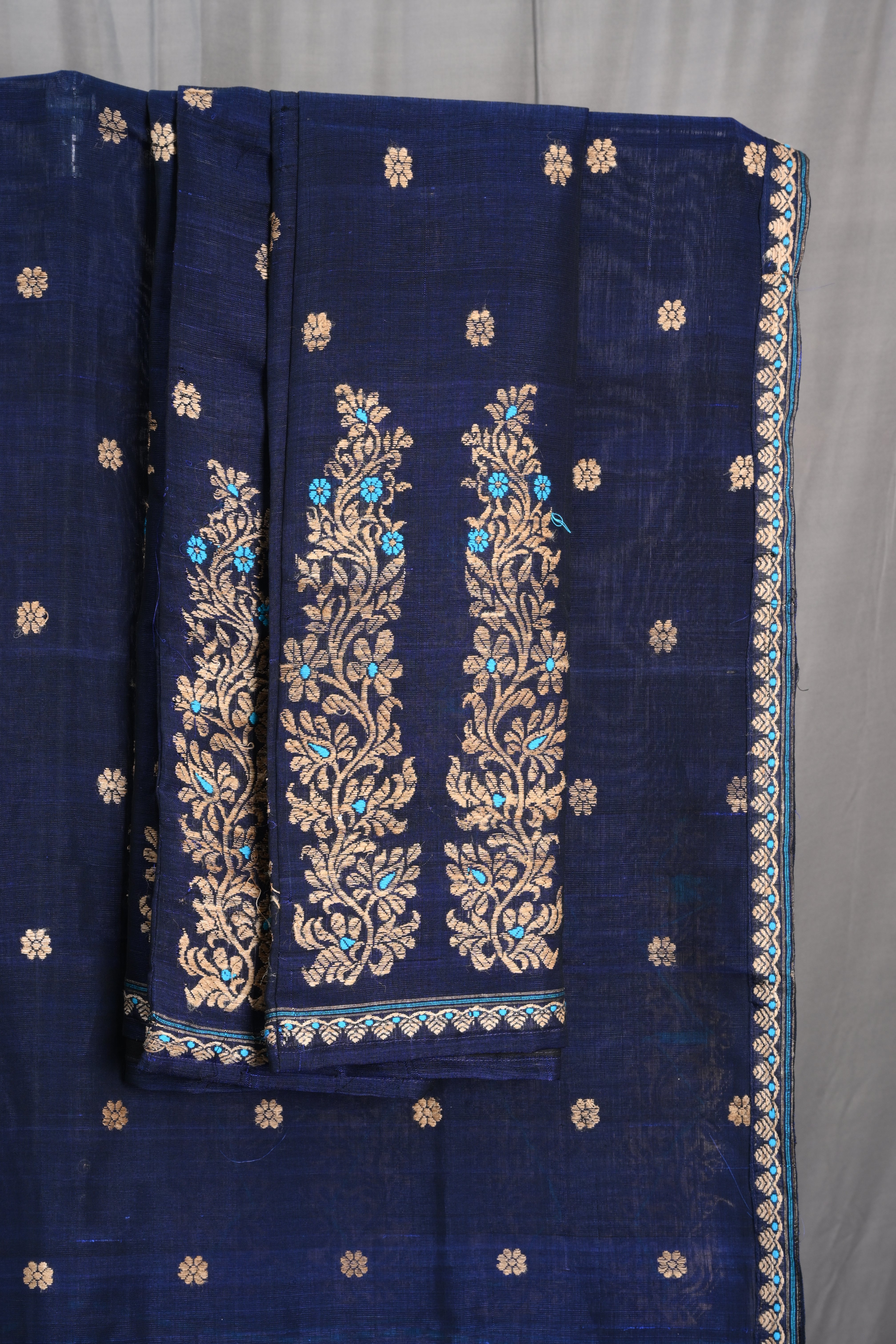 Navy Blue Raw Cotton Mekhela Sador with Muga Ghecha Thread Motifs
