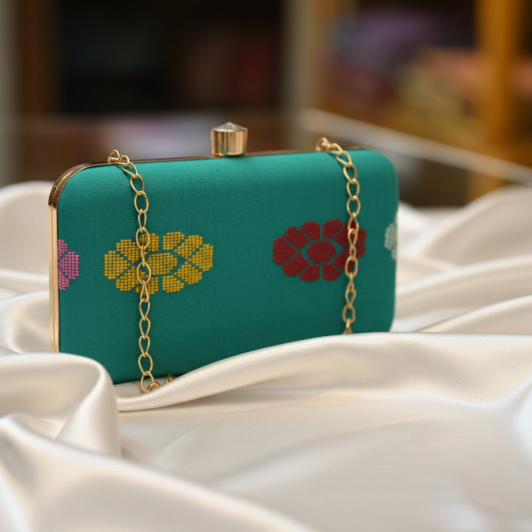Clutch bag of handwoven fabric in Teal Green with ethnic motifs