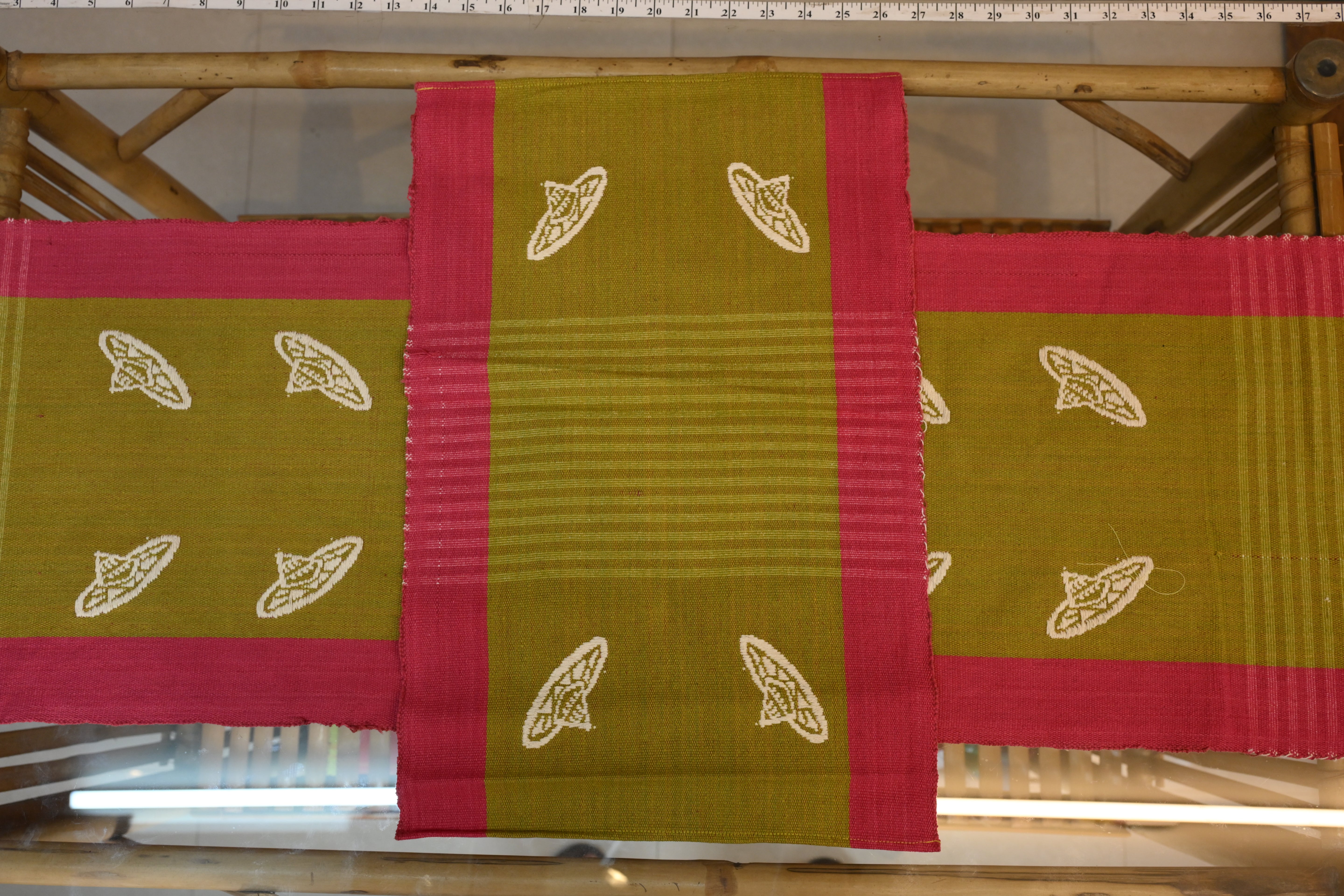 Handwoven Assamese Table Runner Set – Olive Green with Pink Border and White Motifs with 6 Mats