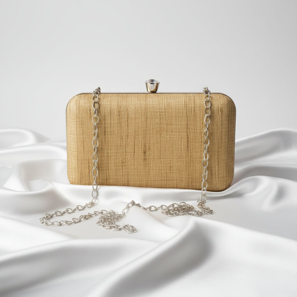 Gheecha Silk clutch bag with a chain strap on a white background