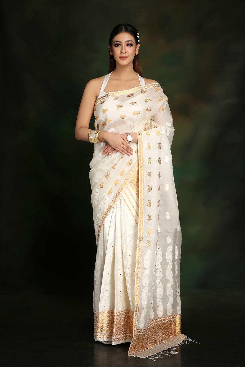 Ivory Raw & Pure Pat Silk Mekhela Chador with Golden Guna and White Eri Motifs